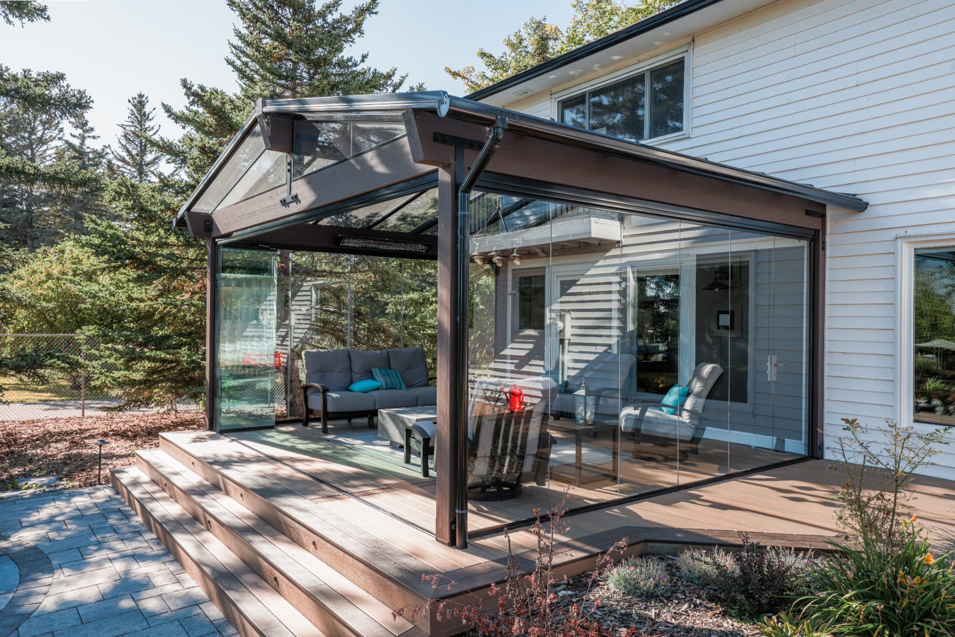 Side view of the enclosure showing the glass gable roof and frameless panels